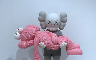 What do critics say about Kaws and his artwork?