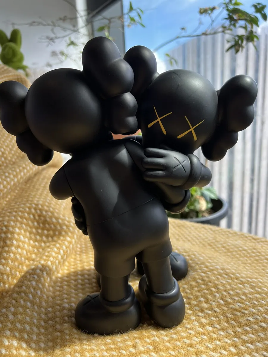 Collection of Kaws\' vinyl toys showcasing the artist\'s contribution to mass art